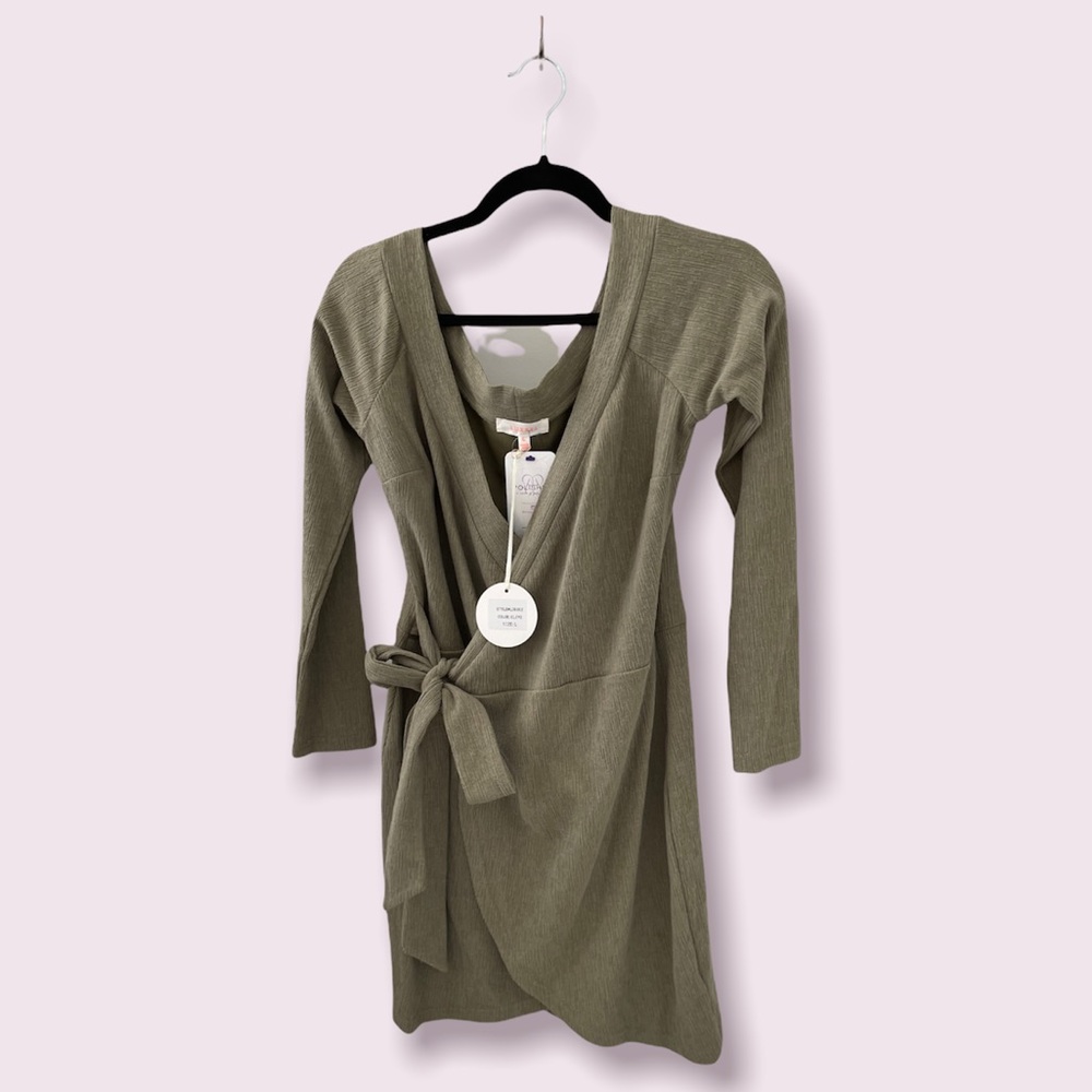 Textured fabric long sleeve dress with side tie closure. Comfortable & stretchy